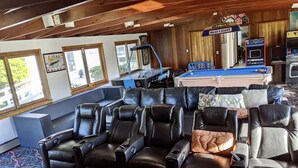 A room with a pool table, billiards, and a billiard cue rack. - 10 Bedroom Hampton House with a regulation size Pickleball court (Hampton Bays)
