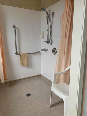 Studio Accessible | Bathroom | Shower, rainfall showerhead, hair dryer, slippers