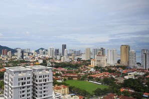 A cityscape with a mix of modern high-rise buildings and traditional low-rise structures. - Tropicana 218 Macalister (George Town)