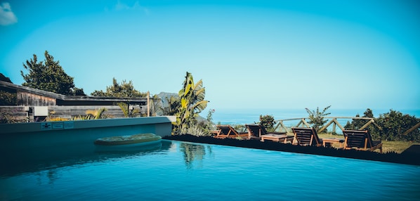 Outdoor pool, pool umbrellas, pool loungers