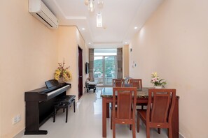 Basic Apartment, 1 King Bed, Non Smoking | Living area | Fireplace, books - Cozzy Seaview Apartment (Ho Chi Minh City)