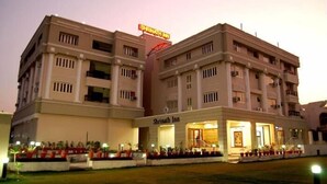 A multi-story hotel with a prominent signage reading "Shrinath Inn." - Hotel Shrinathinn (Nathdwara)