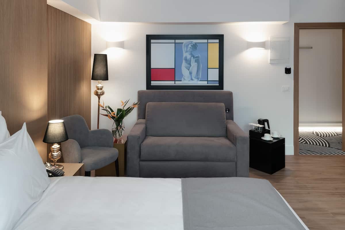 Familjerum (Deluxe) | Sängtillbehör av högsta kvalitet och minibar