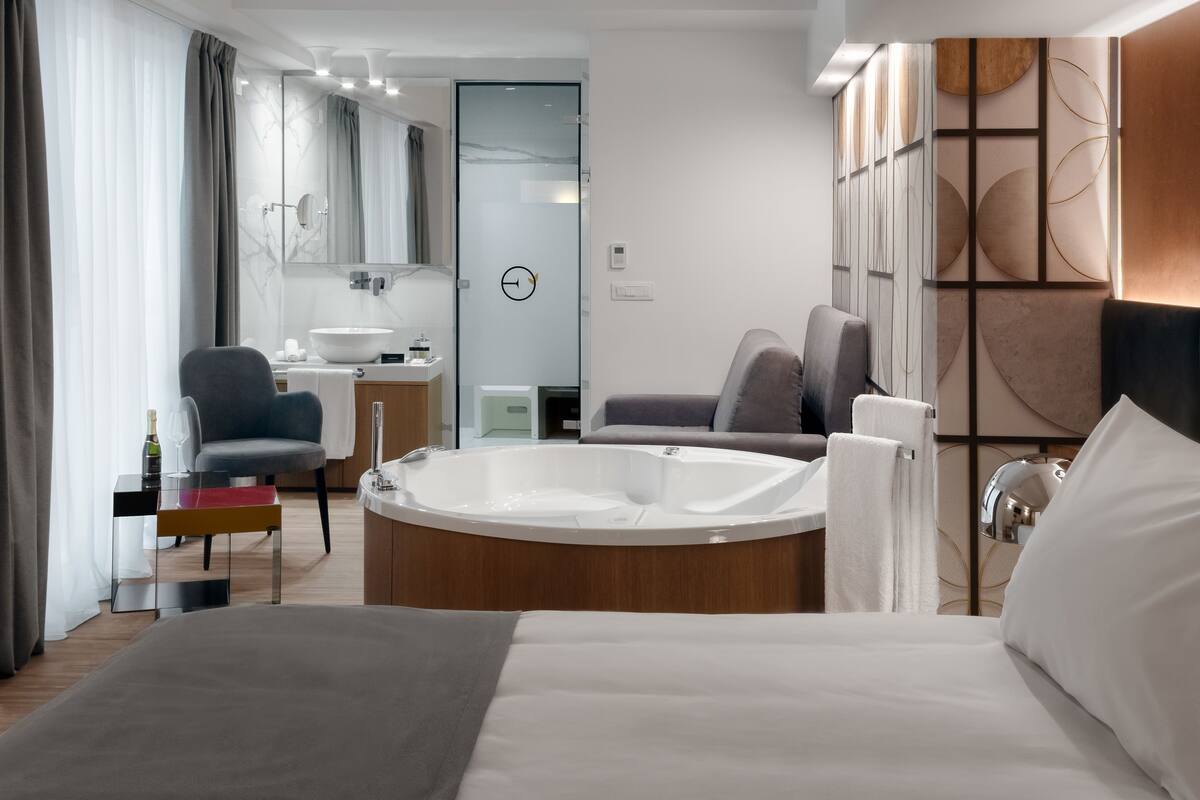 Junior Suite, Jetted Tub | Premium bedding, minibar, in-room safe, desk