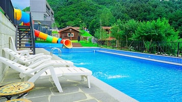 Seasonal outdoor pool, open 1:00 PM to 6:00 PM, pool umbrellas