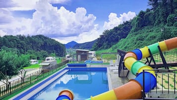 Seasonal outdoor pool, open 1:00 PM to 6:00 PM, pool umbrellas