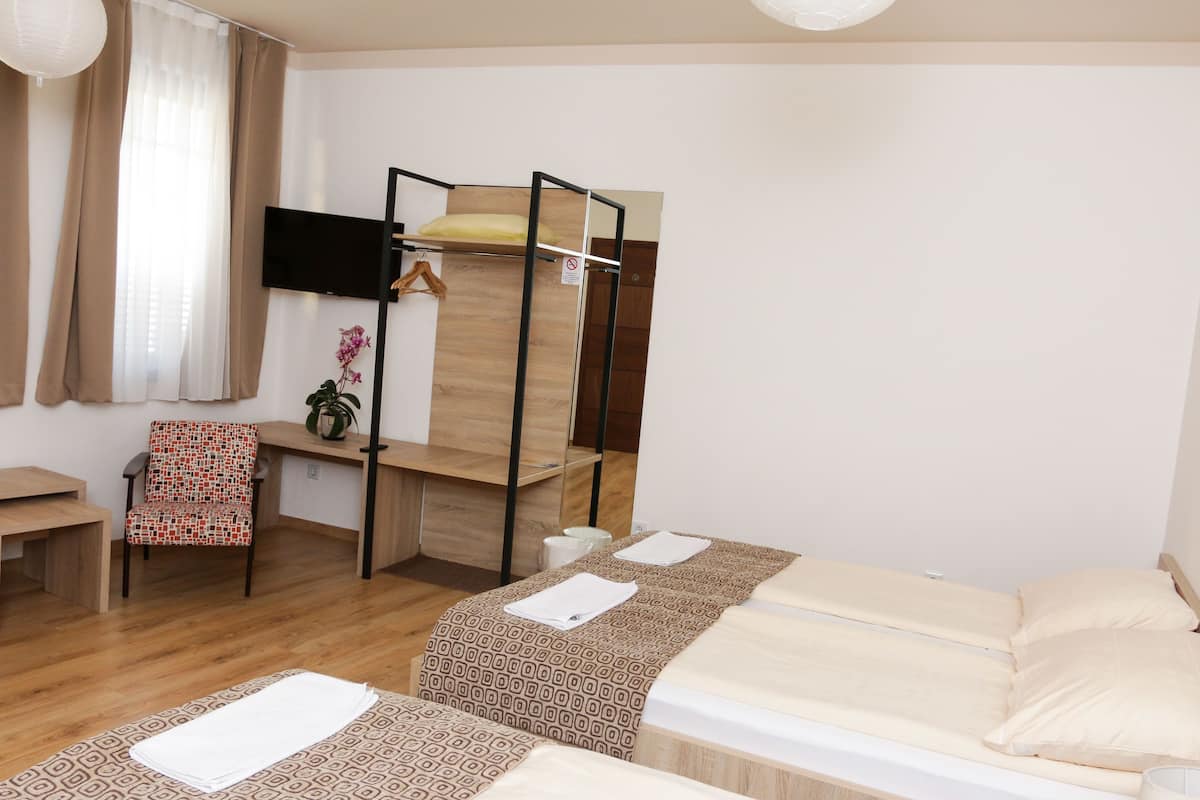 Economy Quadruple Room | Premium bedding, Select Comfort beds, in-room safe, blackout drapes