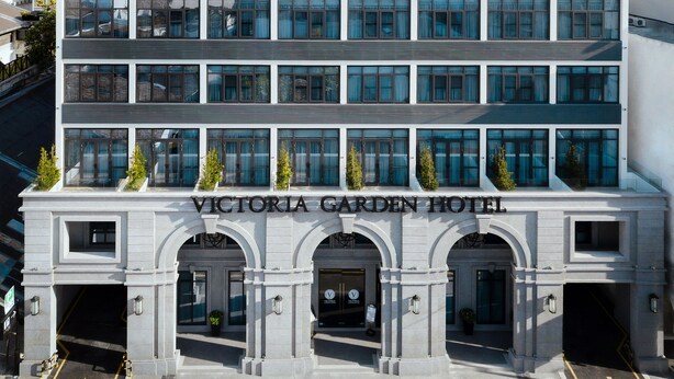 A modern building with the sign "Victoria Garden Hotel" above the entrance. - Victoria Garden Hotel (George Town)