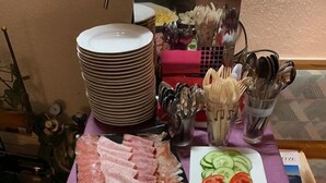 A buffet table with various food items including sliced meats, cheeses, and vegetables. - Gästehaus Edelweiss (Soelden)