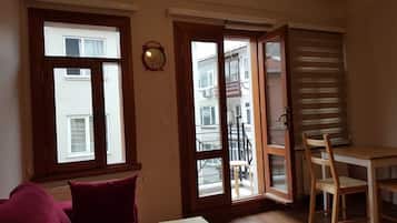 Penthouse, 1 Double Bed with Sofa bed, Non Smoking, City View | Living area | 42-inch flat-screen TV with cable channels, LED TV, streaming services