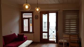 Penthouse, 1 Double Bed with Sofa bed, Non Smoking, City View | Living area | 42-inch flat-screen TV with cable channels, LED TV, streaming services