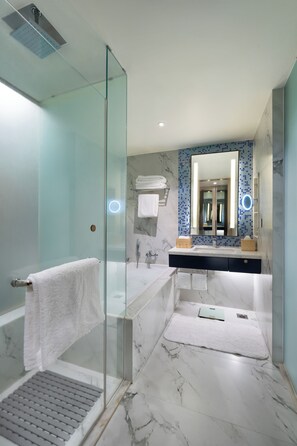 Separate bathtub and shower, free toiletries, hair dryer, bathrobes