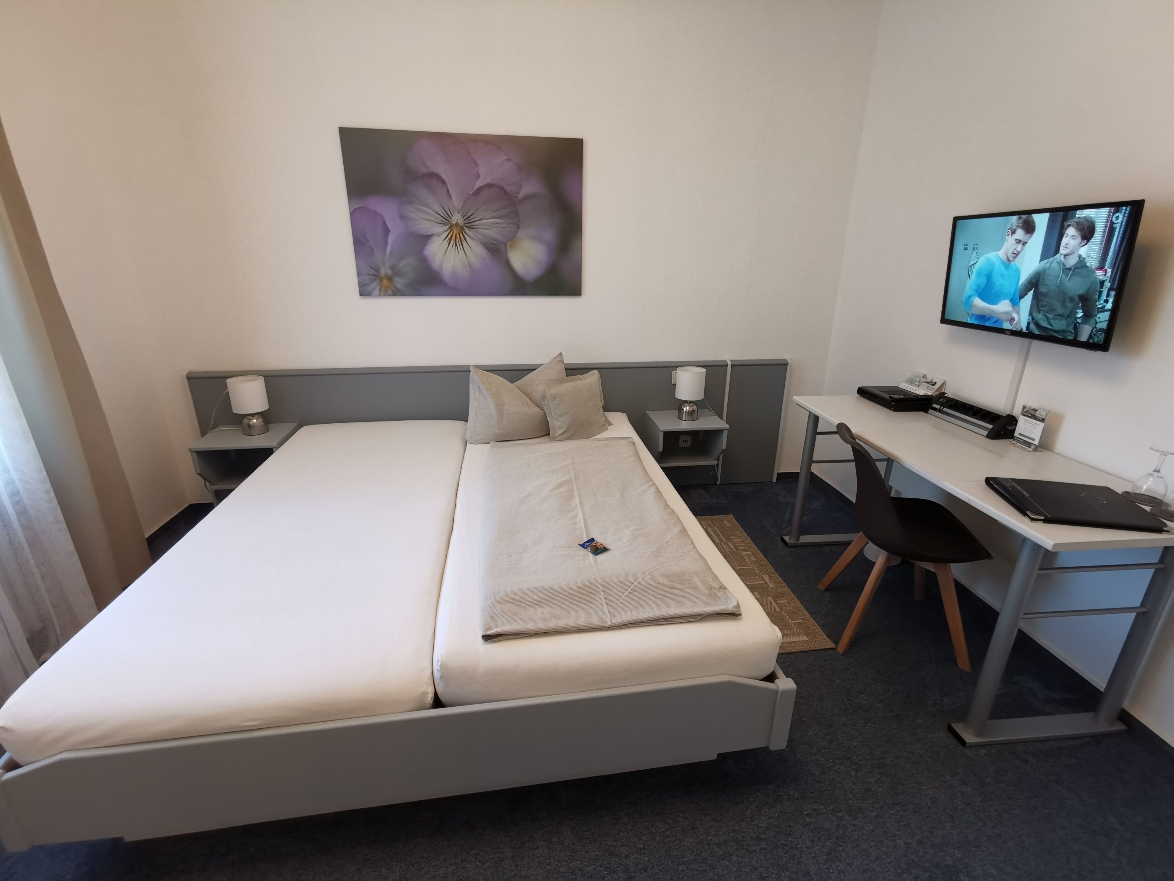 hypo-allergenic bedding, desk, blackout curtains, iron/ironing board