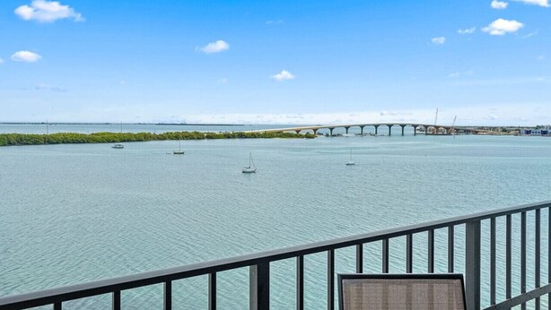 A view of a river with a bridge and boats. - Penthouse Paradise with Amazing Views: 2BD, 2BA - (Isla Del Sol)