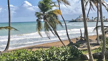 On the beach, sun-loungers, beach towels