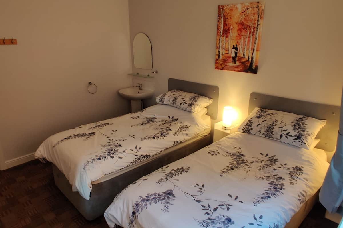 Standard Twin Room, Shared Bathroom | Blackout curtains, iron/ironing board, free WiFi, bed sheets