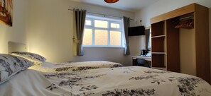 Standard Twin Room, Shared Bathroom | Blackout curtains, iron/ironing board, free WiFi, bed sheets