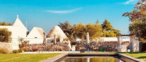 Seasonal outdoor pool, open 8:30 AM to 7:00 PM, pool umbrellas