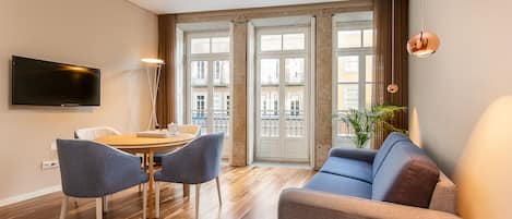 Departamento, 1 habitación | Área de sala de estar | Televisión de pantalla plana