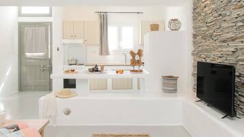 Apartment, 1 Bedroom, Garden View | Living area | 32-inch TV with satellite channels