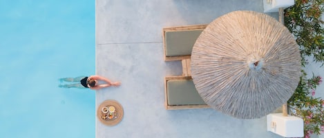 Seasonal outdoor pool, open 8:00 AM to 8:00 PM, pool umbrellas