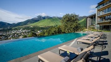 Outdoor pool, open 9:00 AM to 7:00 PM, cabanas (surcharge)