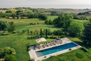 Seasonal outdoor pool, open 7:30 AM to 6:30 PM, pool umbrellas