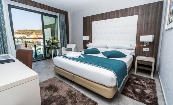 Deluxe Double Room, Pool View | Minibar, in-room safe, blackout drapes, soundproofing