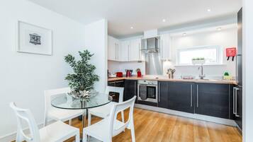 Apartment, 1 Bedroom | Living room | Flat-screen TV, DVD player