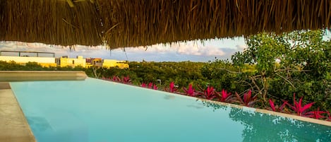 Outdoor pool, open 9:00 AM to 9:00 PM, pool umbrellas, pool loungers