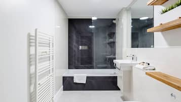 Apartment, 1 Bedroom | Bathroom | Combined shower/bathtub, deep-soaking bathtub, hair dryer, towels