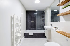 Apartment, 1 Bedroom | Bathroom | Combined shower/tub, deep soaking tub, hair dryer, towels