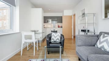 Apartment, 1 Bedroom | Living area | Flat-screen TV