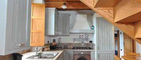 Apartment, 2 Bedrooms, Garden View (Leccio) | Private kitchenette | Fridge, stovetop, coffee/tea maker, cookware/dishes/utensils