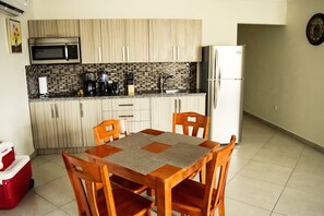 Fridge, microwave, stovetop, coffee/tea maker