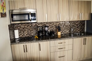 Fridge, microwave, stovetop, coffee/tea maker
