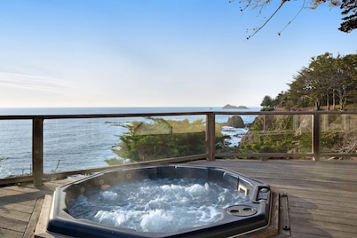 Oceanfront home with private hot tub, views, & close beach access