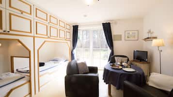 Comfort Condo, 2 Twin Beds, Non Smoking, Garden View | Living area | 70-cm flat-screen TV with satellite channels, TV