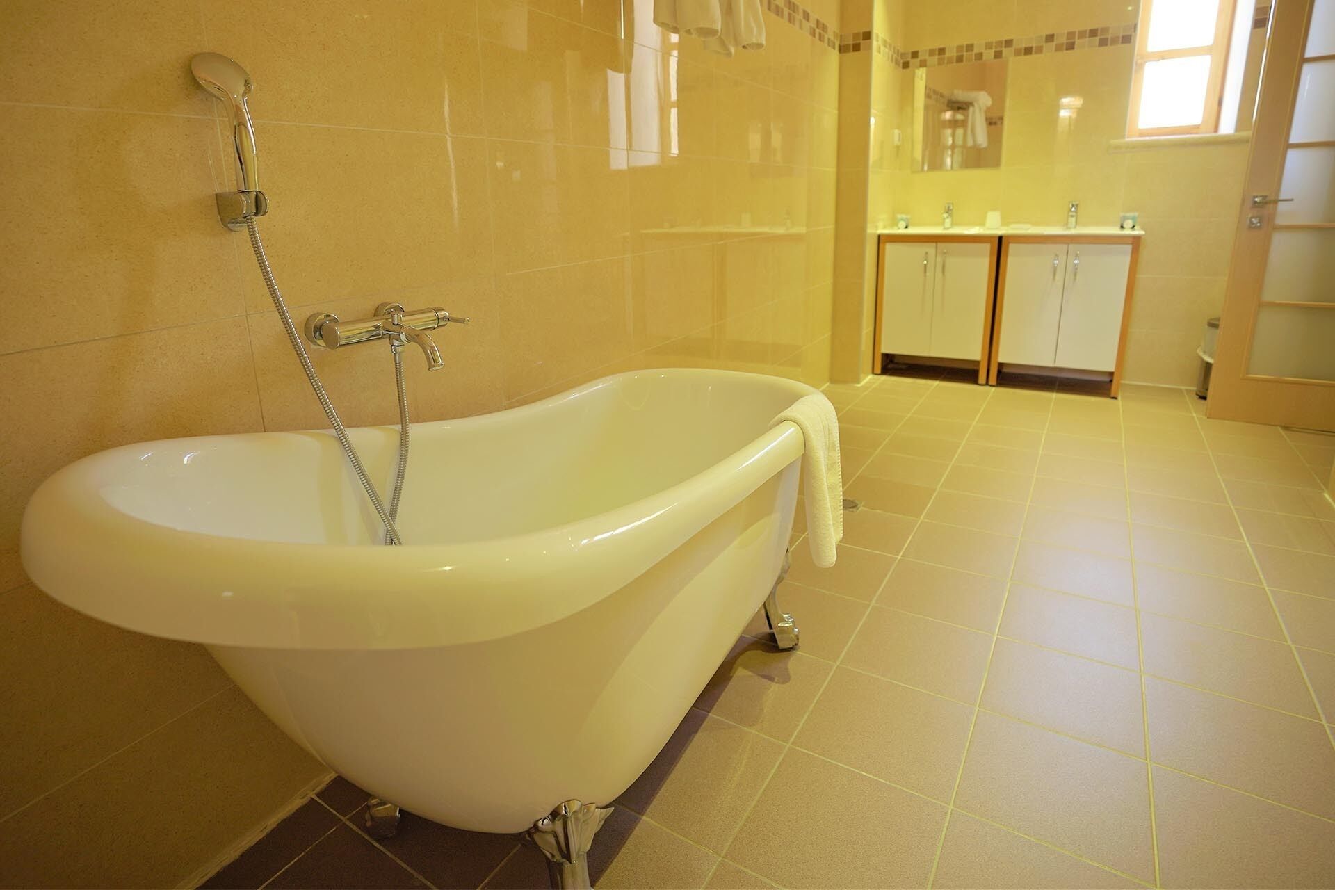 double room-superior-ensuite with bath | bathroom | hair dryer, towels, soap, shampoo