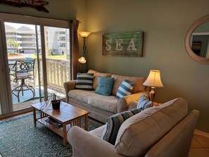 Condo, 2 Bedrooms | Living area | Flat-screen TV - Baywatch by Surfside VR (Pensacola Beach)