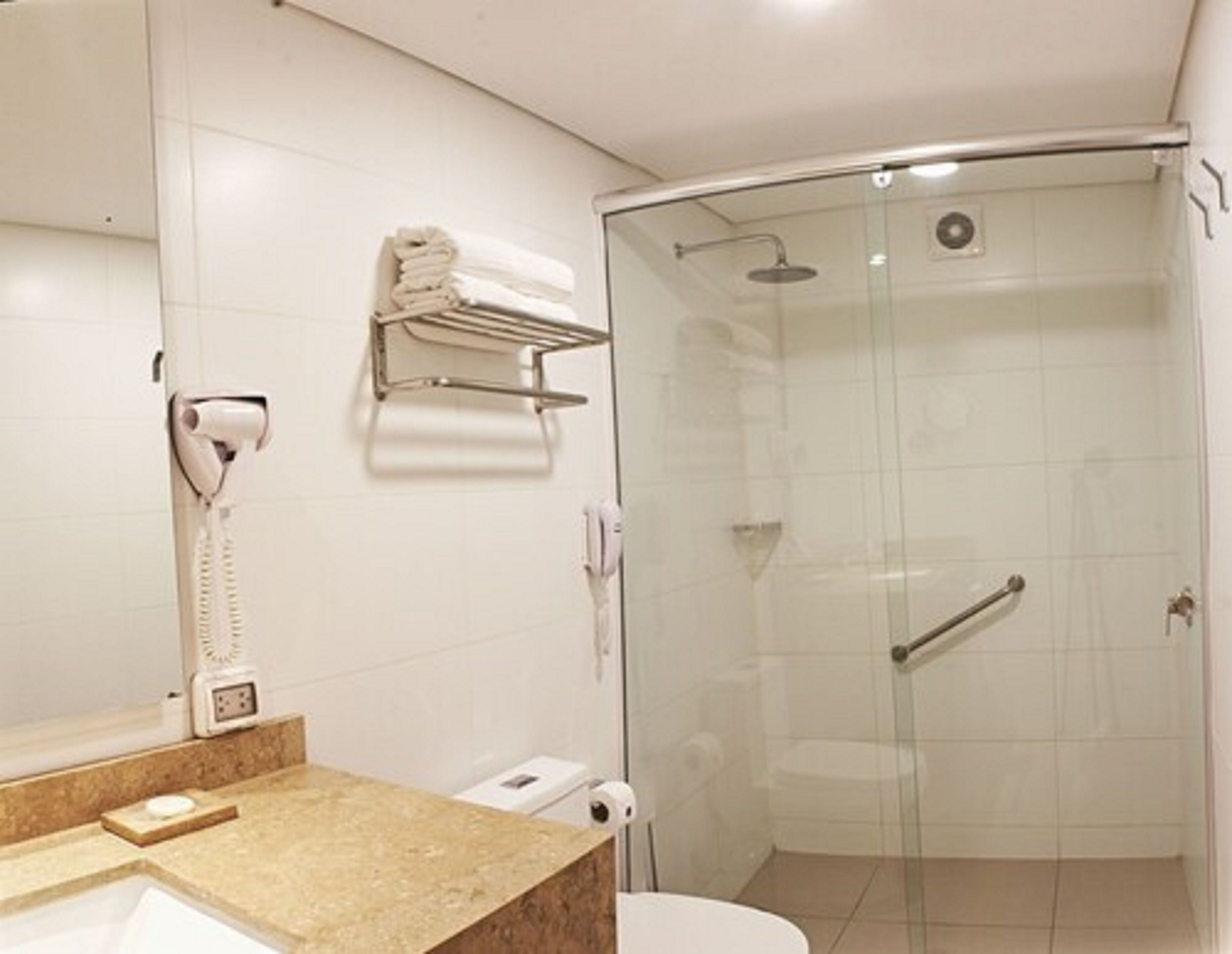 junior room, 1 king bed | bathroom | shower, rainfall showerhead, hair dryer, towels