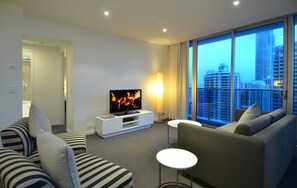 Enjoy city views from the large window, relax in the seating area with a flat-screen TV and comfortable sofas.