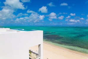 On the beach, sun loungers, beach towels