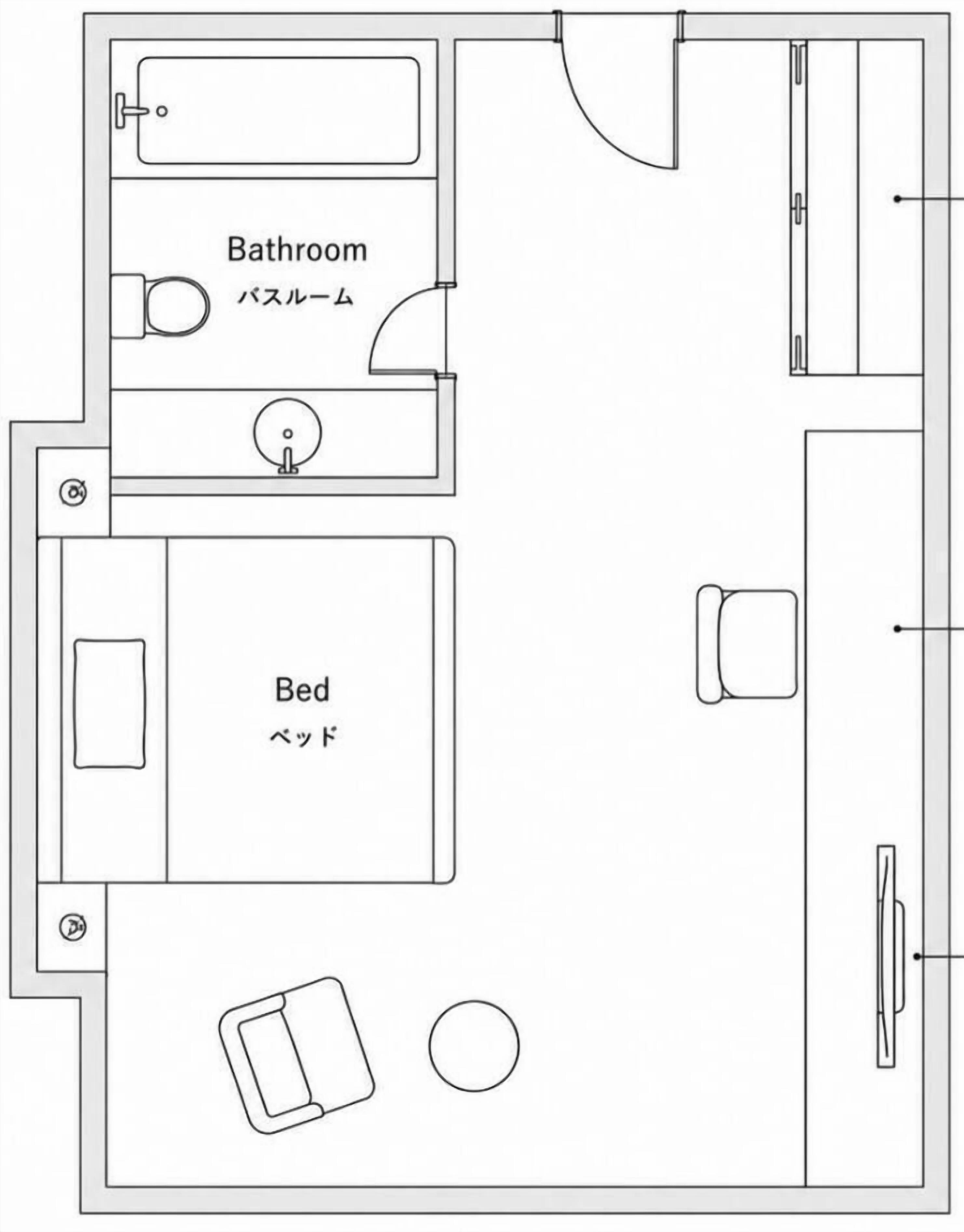 A floor plan with a bathroom, bed, and a small table.