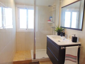 Bathtub, hair dryer, towels, soap