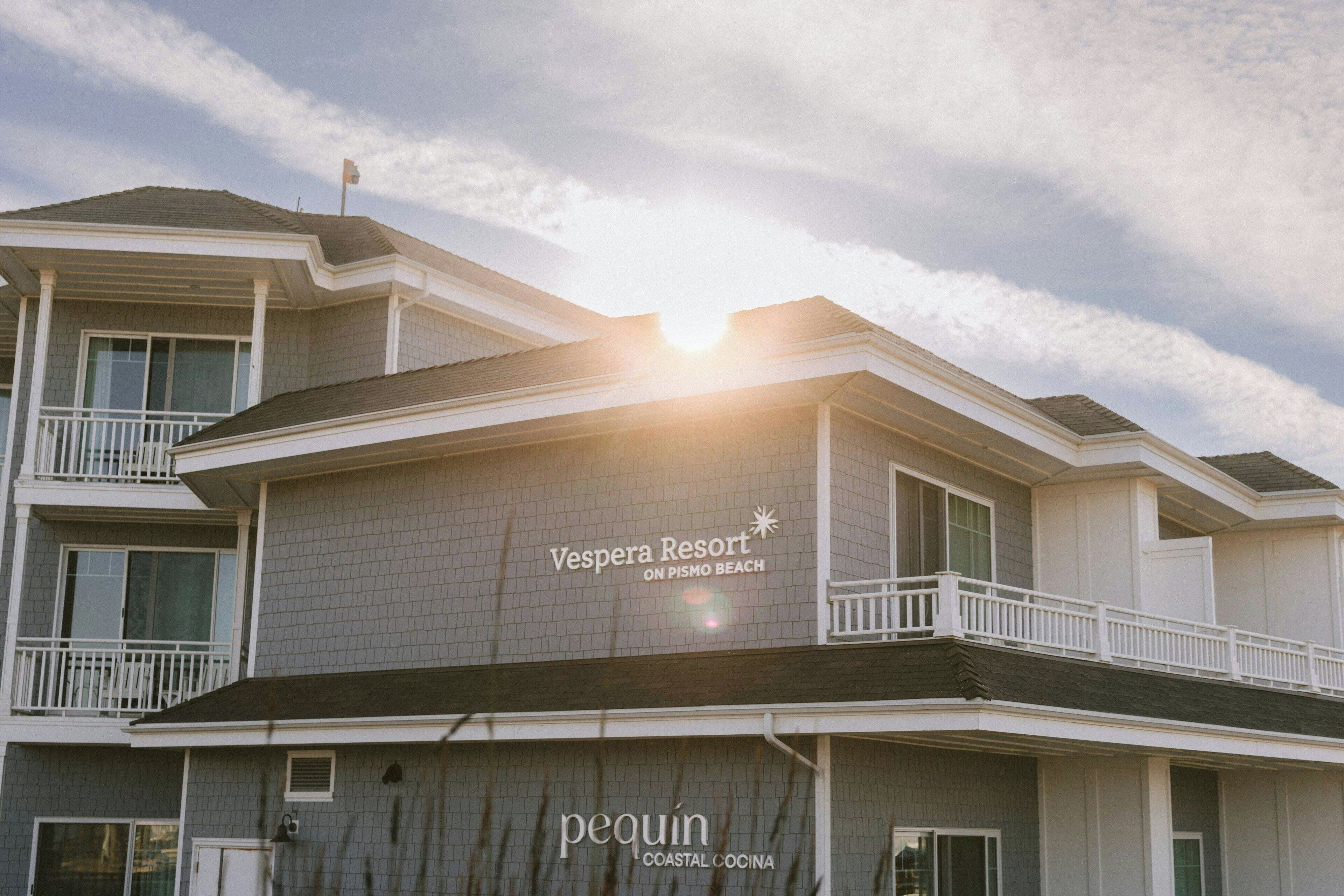A hotel named 'Vespera Resort' with a sign for 'Pequin Coastal Cuisine'.