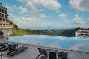 Outdoor pool, open 7:00 AM to 9:00 PM, pool umbrellas, sun loungers - Twin Lakes Hotel - near Tagaytay (Laurel)
