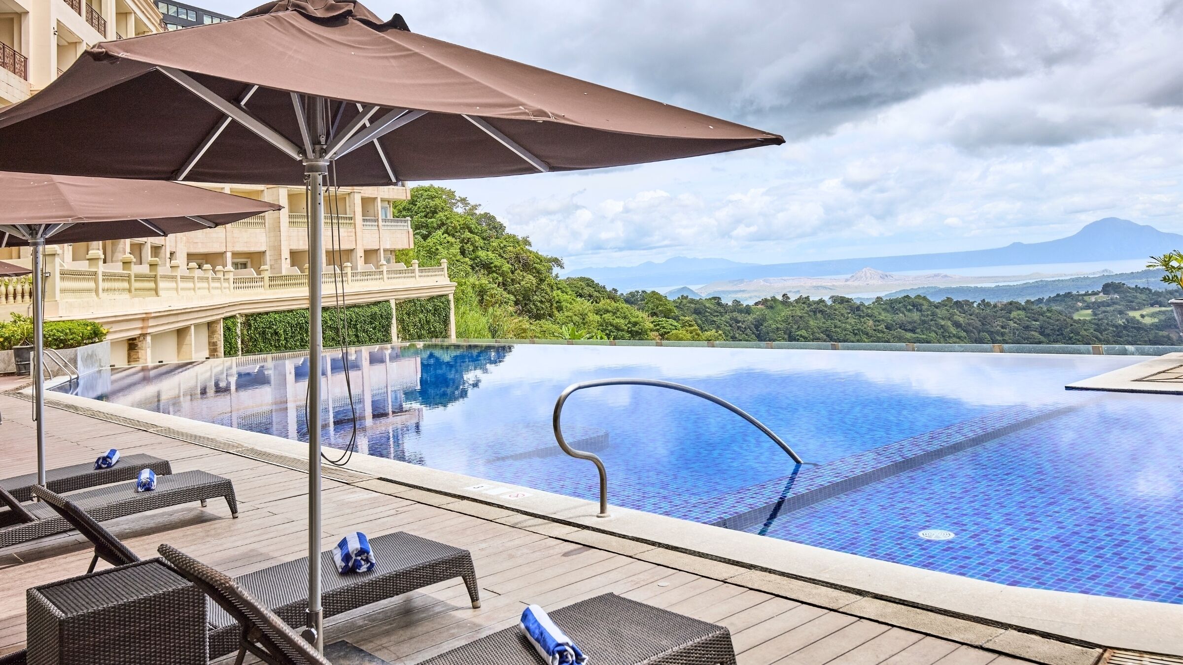 outdoor pool, open 7:00 am to 9:00 pm, pool umbrellas, pool loungers