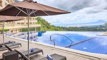 Outdoor pool, open 7:00 AM to 9:00 PM, pool umbrellas, pool loungers