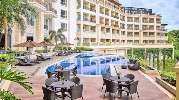 Outdoor pool, open 7:00 AM to 9:00 PM, pool umbrellas, sun loungers